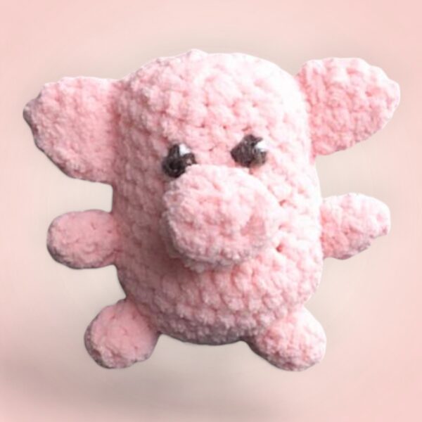 Mignon petit cochon rose crocheté à la main.