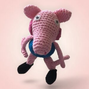 Adorable peluche de Georges Pig, le petit frère de Peppa Pig.